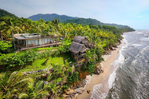 Charming oceanfront cabin with stunning views, private terrace, and beach access