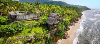 Charming oceanfront cabin with stunning views, private terrace, and beach access