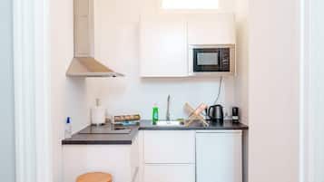 Fridge, microwave, coffee/tea maker, cookware/dishes/utensils
