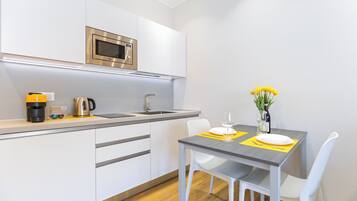 Fridge, microwave, stovetop, coffee/tea maker