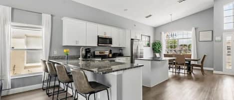 Coffee/tea maker, fridge, microwave, oven