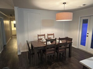 Enjoy meals in this dining area with a large table and six chairs.