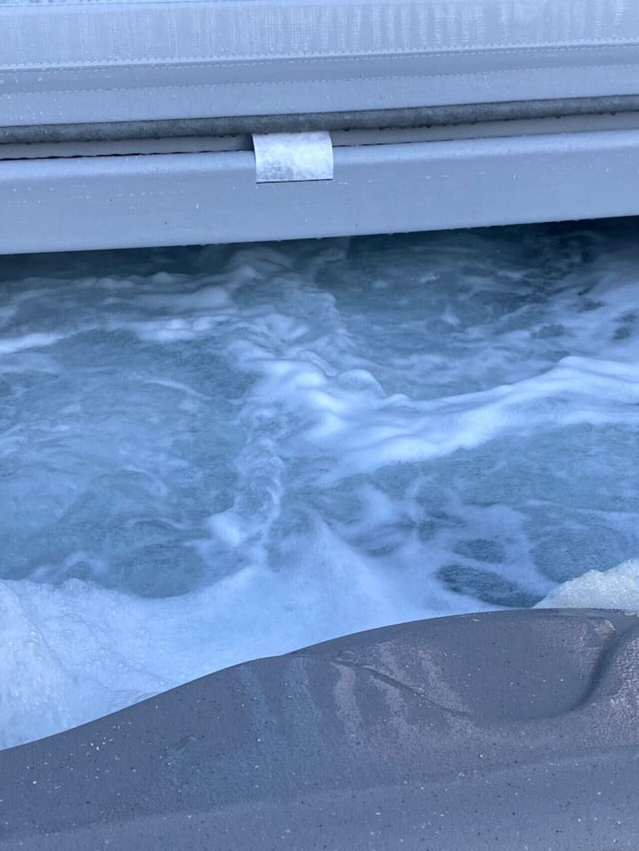 A pool with clear water and visible ripples.