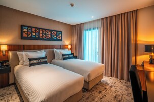 Ropa de cama hipoalergénica y minibar con artículos gratuitos
