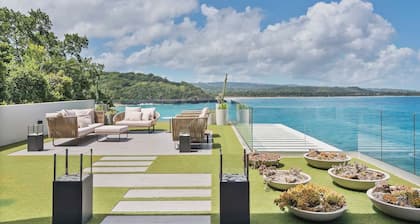 Gorgeous Beach House Perched Right Over the Ocean