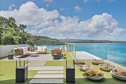 Gorgeous Beach House Perched Right Over the Ocean