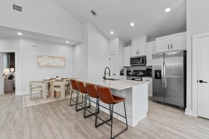 Fridge, microwave, oven, stovetop - Luxury Group Retreat w/ 2 Kitchens, Backyard, Balcony + 5-Car Parking (Austin)