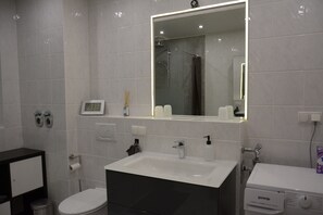 Shower, hair dryer, towels, soap