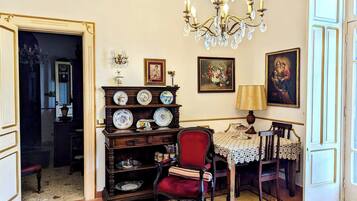 Deluxe Suite, City View | Living area | TV
