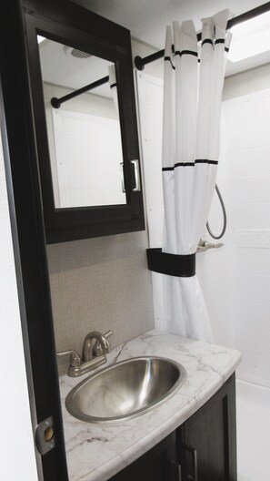 Shower, eco-friendly toiletries, hair dryer, towels - Spacious Glamper with TWO fireplaces, sleeps 2-4 in charming Dripping Springs (Dripping Springs)
