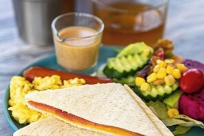 A plate with a sandwich, scrambled eggs, and a side salad. - Meet Sun Moon Lake (Nantou)