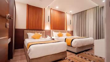 Family Quadruple Room, City View | 1 bedroom, in-room safe, desk, laptop workspace