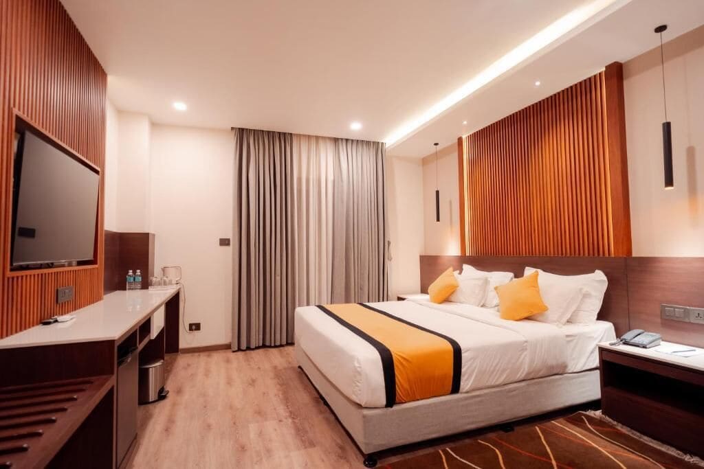 Deluxe Studio Suite, Balcony, City View | In-room safe, desk, laptop workspace, blackout drapes