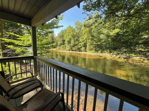 Charming riverfront home with beautiful views, hot tub and game room. Fishing!