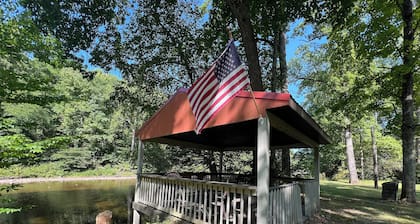 Charming riverfront home with beautiful views, hot tub and game room. Fishing!