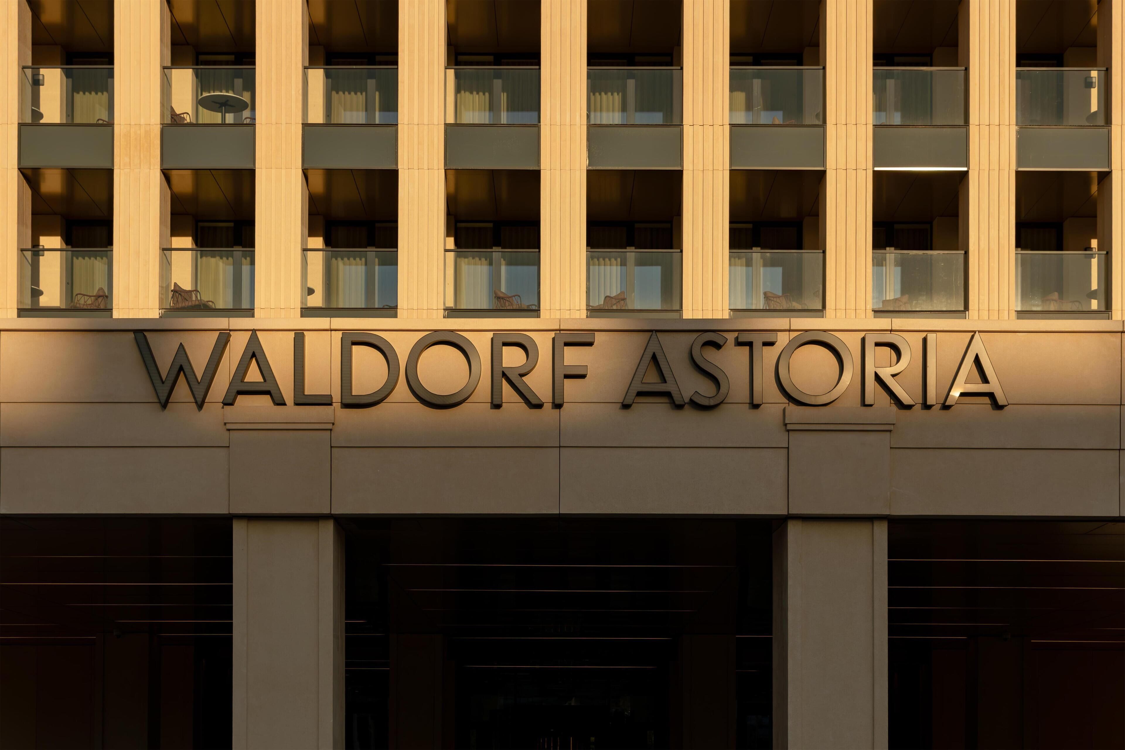 A building facade with the name 'WALDORF ASTORIA' prominently displayed.