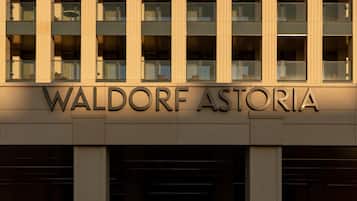 A building facade with the name 'WALDORF ASTORIA' prominently displayed.