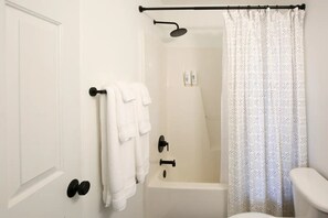 Hair dryer, towels, soap, shampoo
