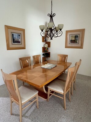 Enjoy meals in this cozy dining area with a large table and comfortable seating for six.