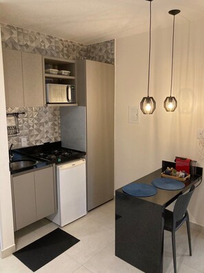 Fridge, microwave, coffee/tea maker, cookware/dishes/utensils