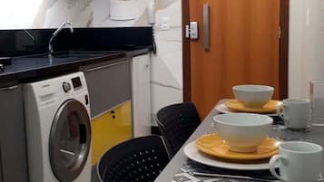 Fridge, microwave, coffee/tea maker, cookware/dishes/utensils