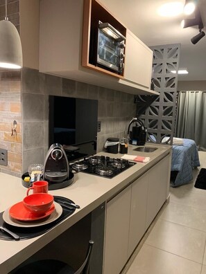 Fridge, oven, coffee/tea maker, cookware/dishes/utensils