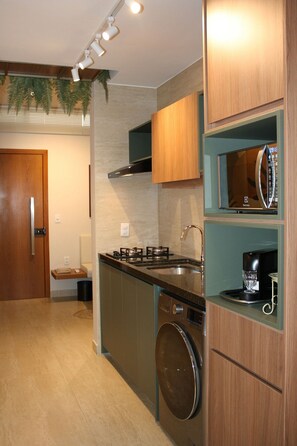 Fridge, microwave, coffee/tea maker, cookware/dishes/utensils