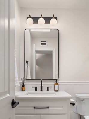 Shower, eco-friendly toiletries, hair dryer, towels