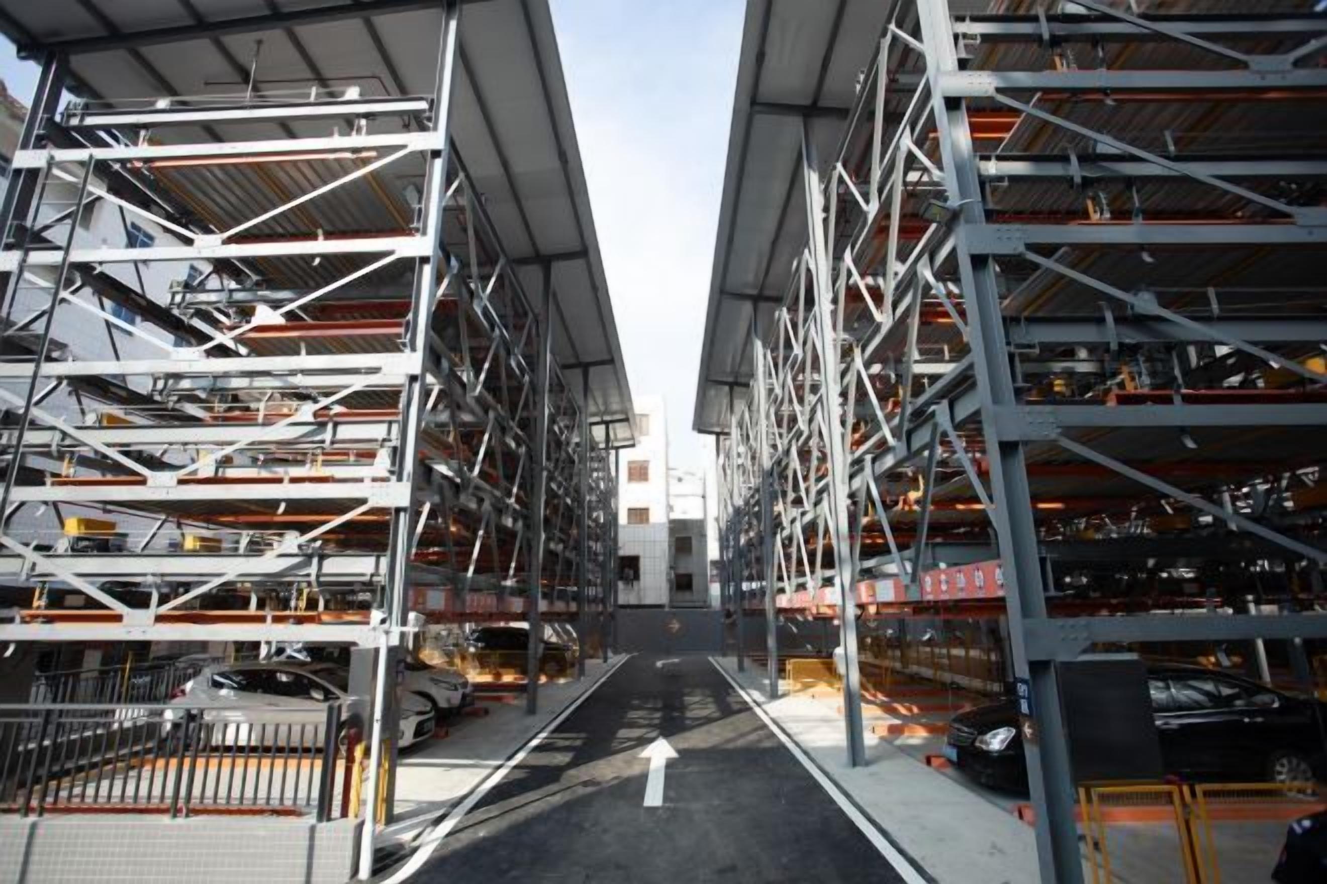 A multi-level parking garage with numerous rows of parking spaces and a central walkway.