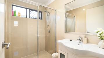 Shower, hair dryer, soap, shampoo