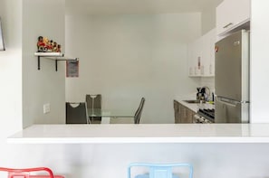Fridge, microwave, stovetop, coffee/tea maker
