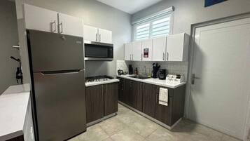 Fridge, microwave, stovetop, coffee/tea maker