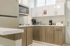 Fridge, microwave, stovetop, coffee/tea maker