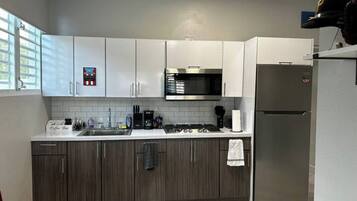 Fridge, microwave, stovetop, coffee/tea maker