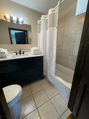Hair dryer, towels, soap, shampoo