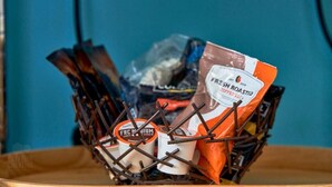 A basket containing various items including a coffee bag and a container labeled 'FRL'.