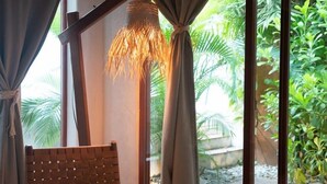 A room with a wooden bench, large windows with curtains, and a woven light fixture. - Casa Coconut (Brisas de Zicatela)