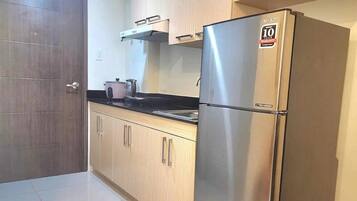 Fridge, electric kettle, highchair, cookware/dishes/utensils