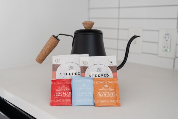 A coffee maker with a cork handle and a kettle on a kitchen counter. - Studio Haus East 6th Austin by Kasa (Austin)
