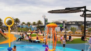 A water park with various play structures and a pool area. - Beachside Townhouse - New Brighton (Christchurch)