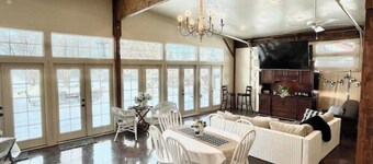 Red Roof Farmhouse has beds for 27, a 12 person swim spa, 1350 sq ft activity rm