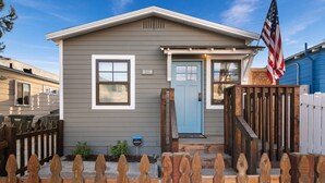 A single-story house with a light blue door, a number 5119 sign, and an American flag. - 1 Block to Ocean * Brand New Remodel * Dog OK! (San Diego)