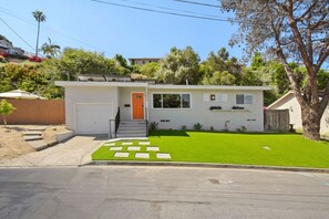 A modern two-story house with a front yard, a driveway, and a garage. - Sunnyside Resort Spa, Beach, Zoo, Arcade (La Mesa)