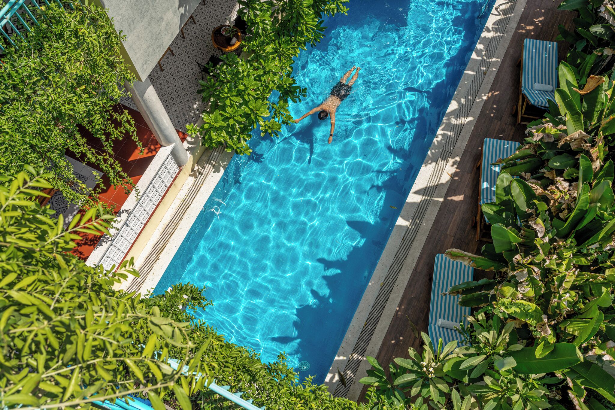 Outdoor pool, open 9:00 AM to 9:00 PM, pool umbrellas, pool loungers