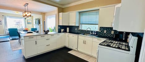 Coffee/tea maker, fridge, microwave, oven