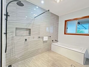 Shower, hair dryer, towels, shampoo