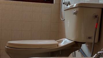 Deluxe Double Room, Mountain View | Bathroom | Slippers, towels, soap, shampoo