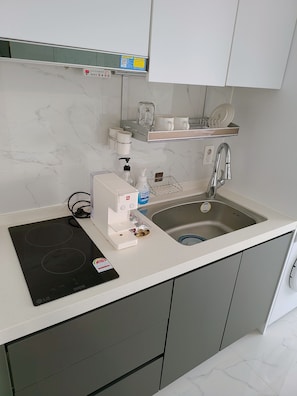 Fridge, microwave, electric kettle, cookware/dishes/utensils