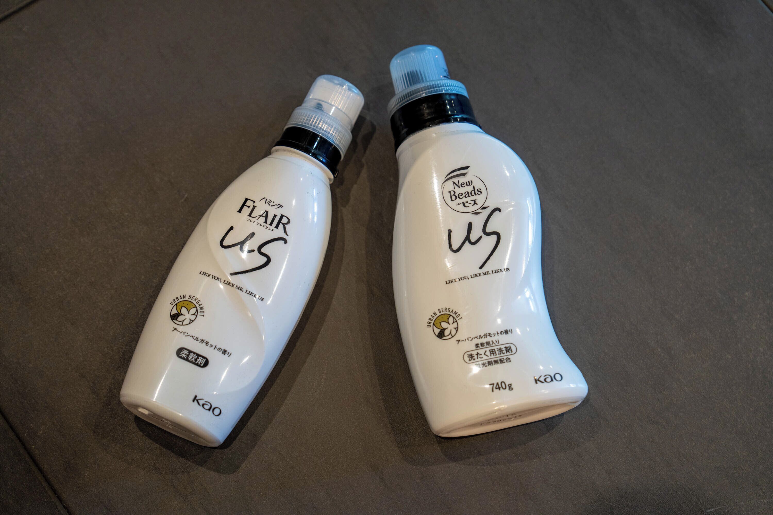 Two bottles of hair care product on a countertop.