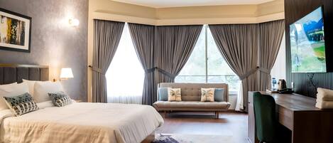Deluxe Suite, Balcony, Mountain View | In-room safe, desk, laptop workspace, free WiFi